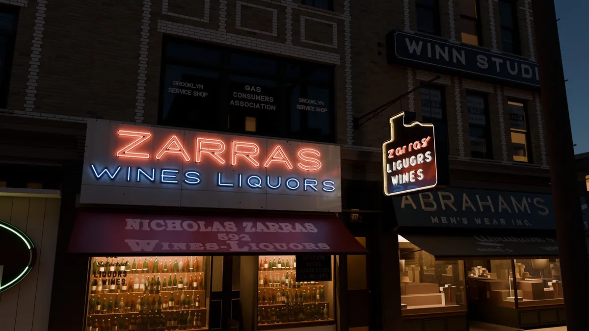 The same Zarras storefront at night, with red and blue neon lit on the board and hanging sign and a lit shop window full of bottles.
